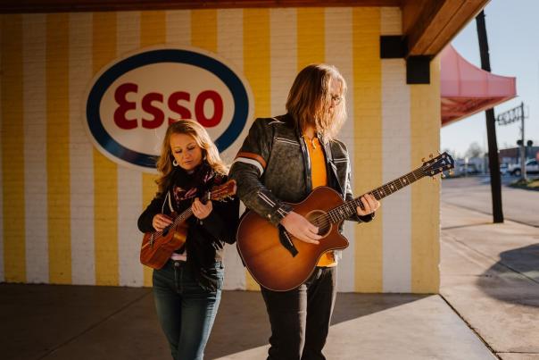 Two musicians playing guitar