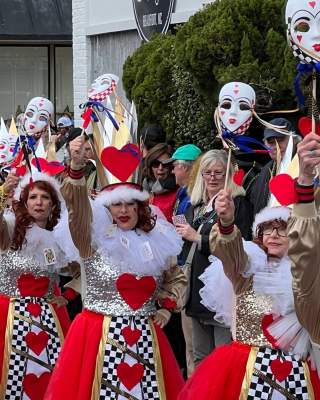 mardi gras parade participants in vibrant costumes