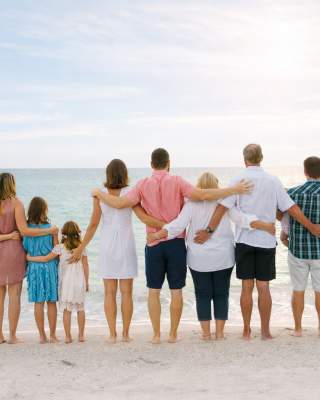 a reunion of people on the beach looking out over the ocean