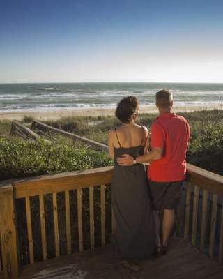 Couple Overlooking the Ocean