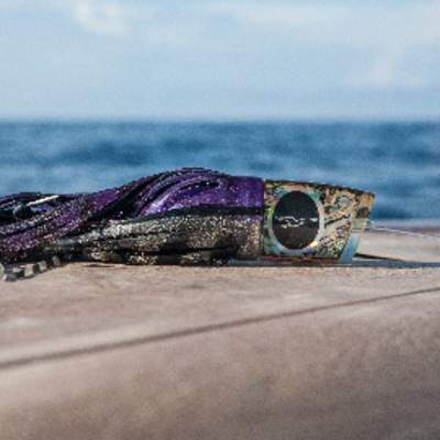 a fishing lure sitting on a dock