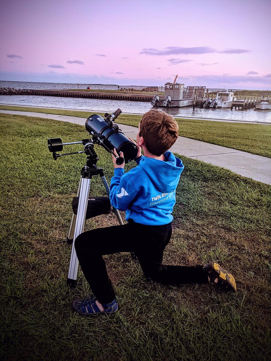 Boy with a telescope
