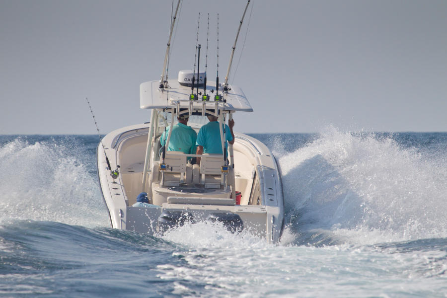 two people riding a boat out into the ocean