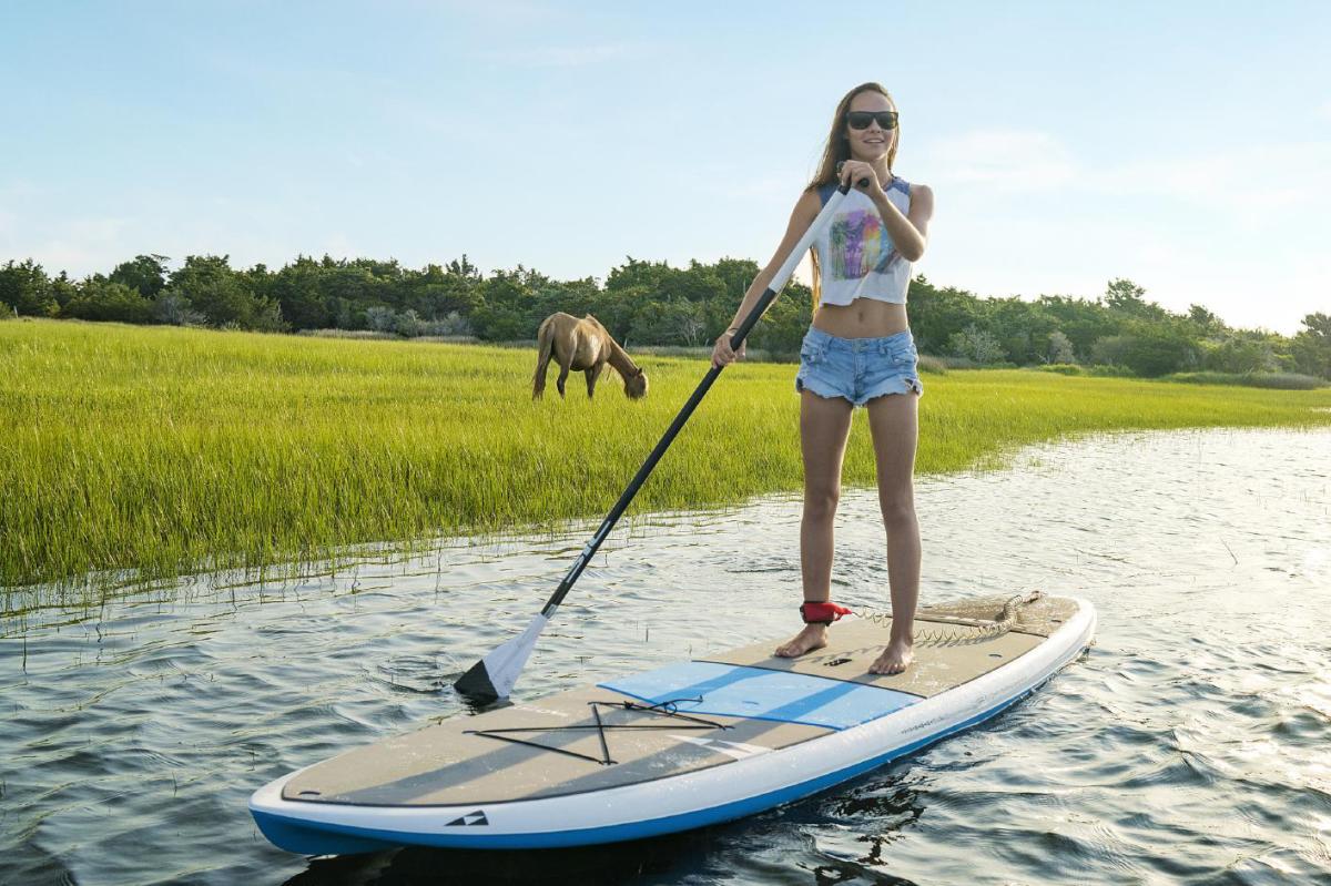 Woman Paddling with Horses