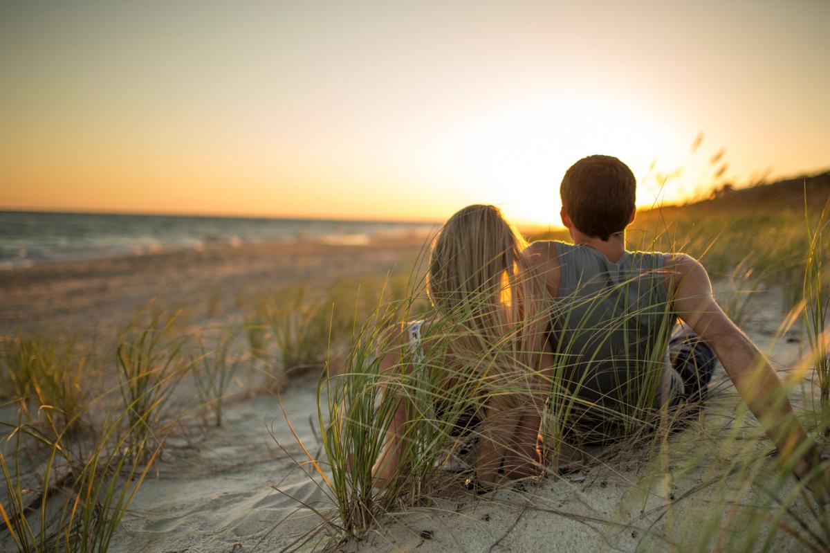 Couple on beach at sunset
