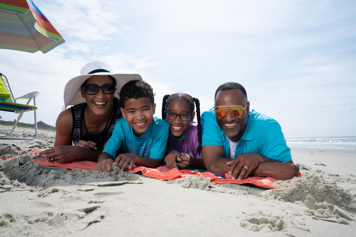 Family of four on the beach