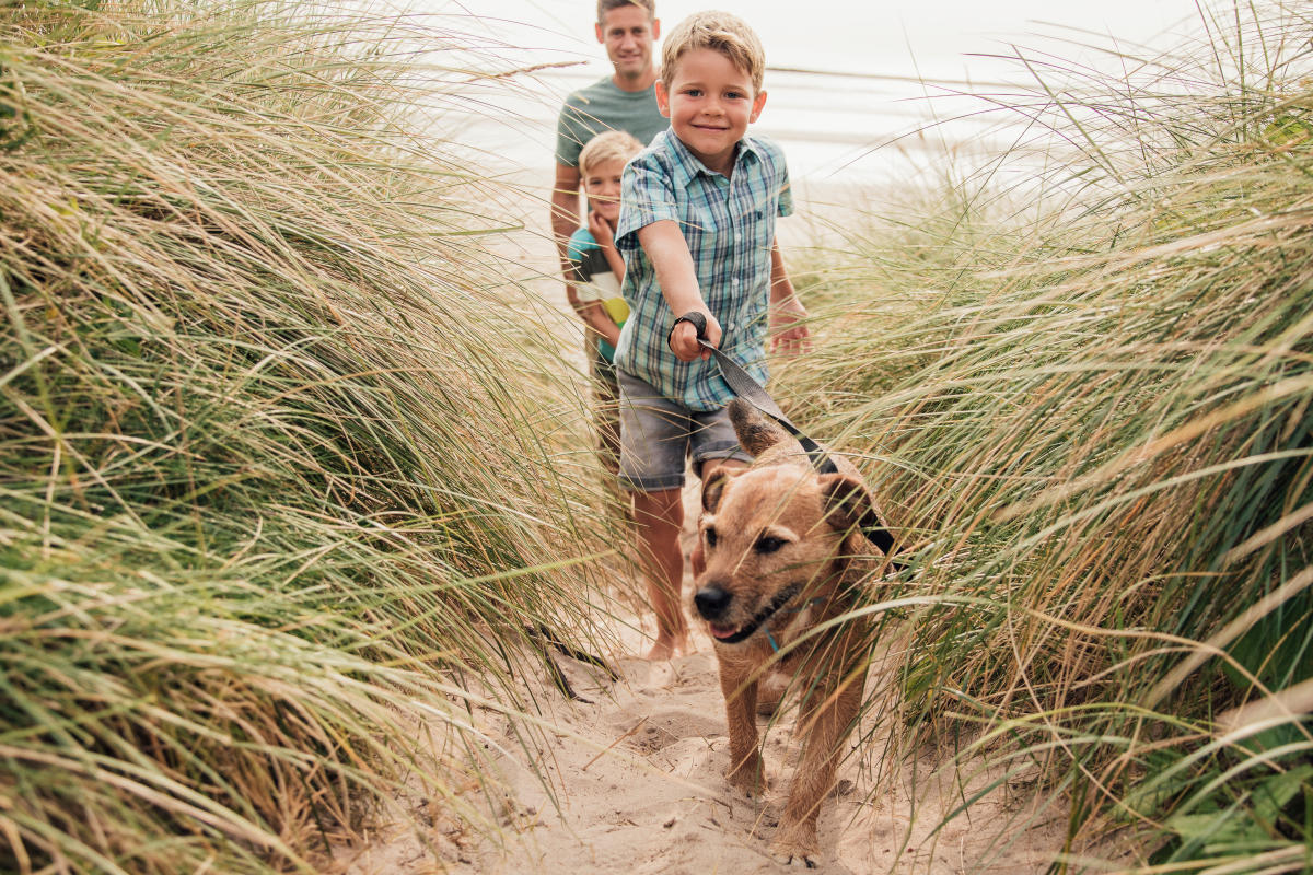 Family with dog on beach