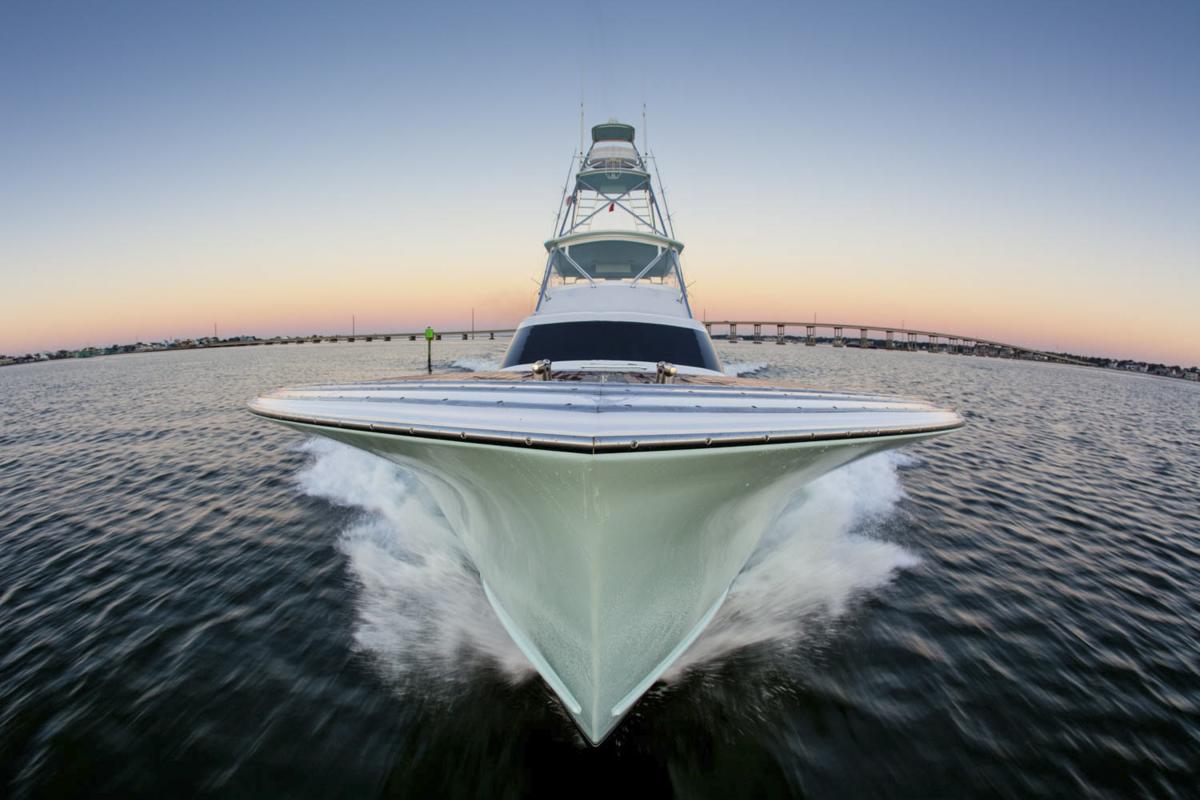 bow of large boat with the sun setting in the background