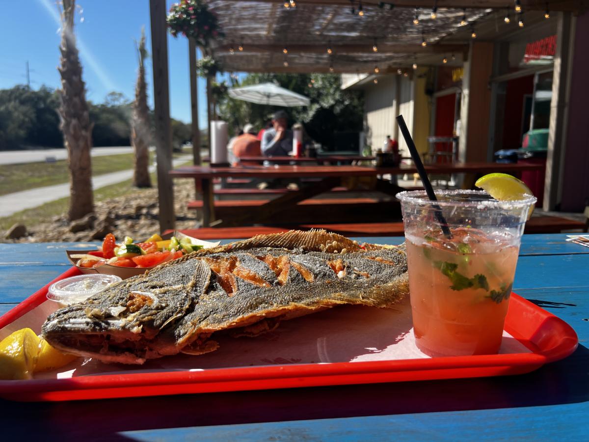 Fish Hut Grill full fish and a drink