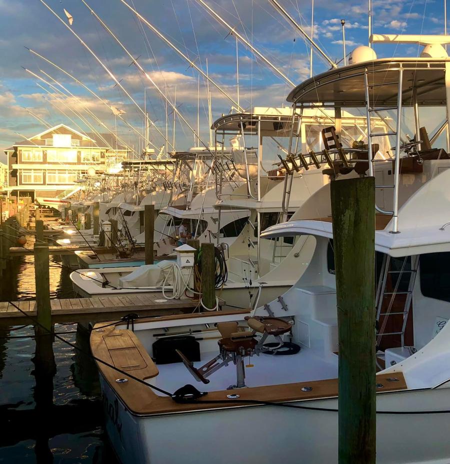 Multiple boats docked on the Morehead City waterfront docks