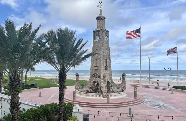 Coquina Clock Tower and American flag at Daytona Beach