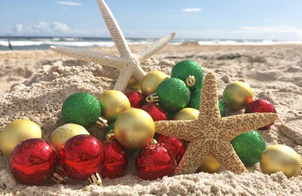 A creative array of Christmas tree ornaments and starfish on Daytona Beach