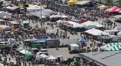 The midway at Daytona International Speedway is teeming with vendors and crowds