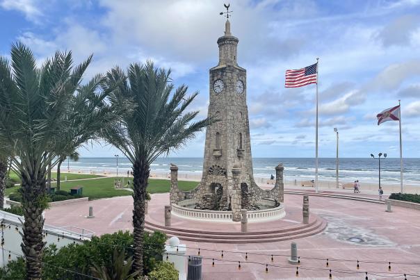 Coquina Clock Tower and American flag at Daytona Beach