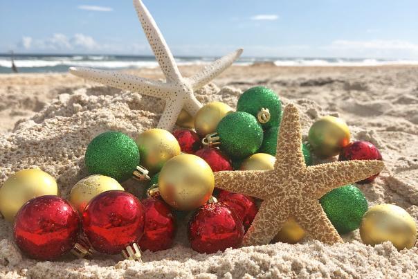 A creative array of Christmas tree ornaments and starfish on Daytona Beach