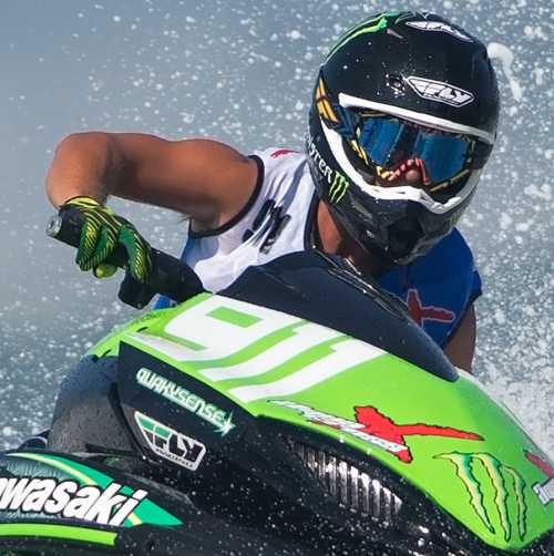 Person, in a competition, on a jet ski in the ocean off of Daytona Beach.