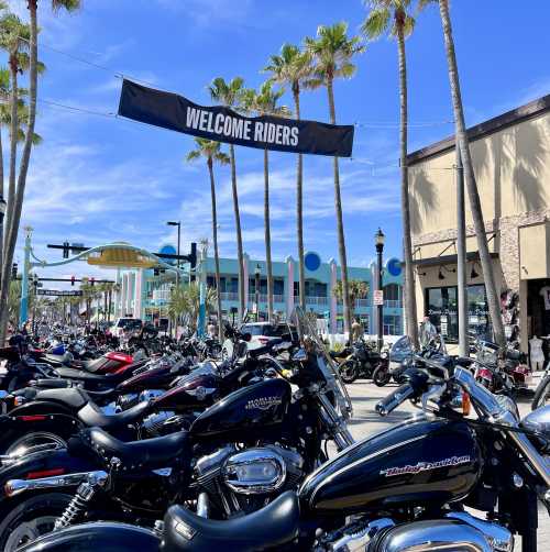 A group of people and motorcycles on Main Street in Daytona Beach, Florida during Bike Week.