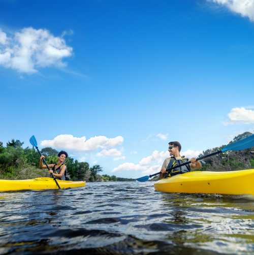 Couple Kayaking on the River