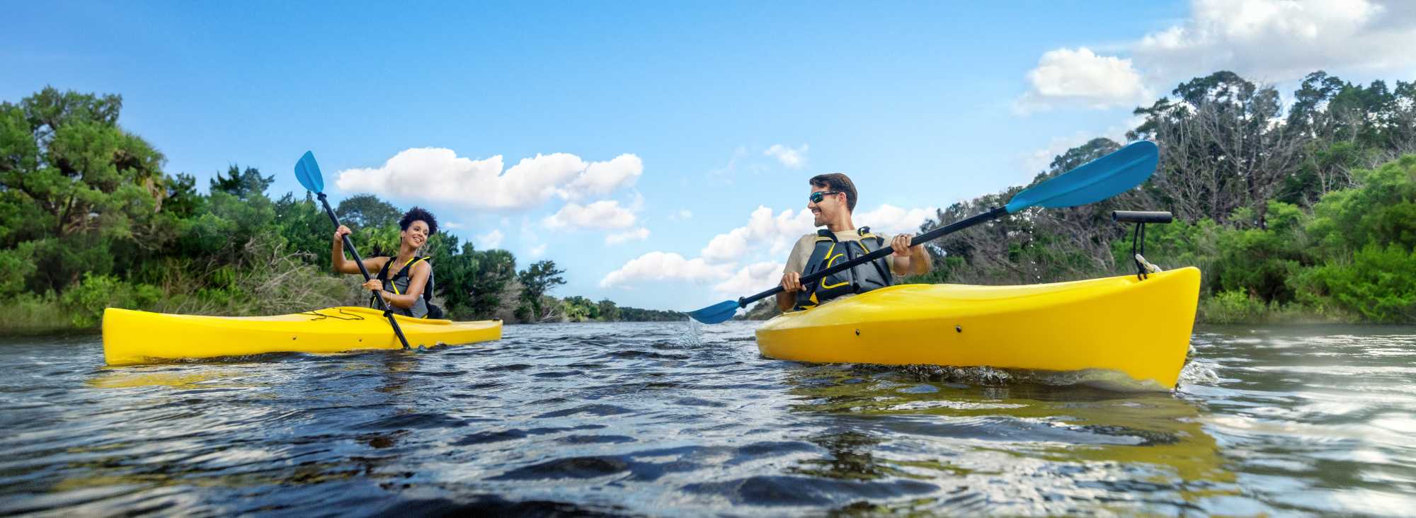 Couple Kayaking on the River
