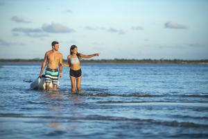 Couple Paddleboarding in Daytona Beach