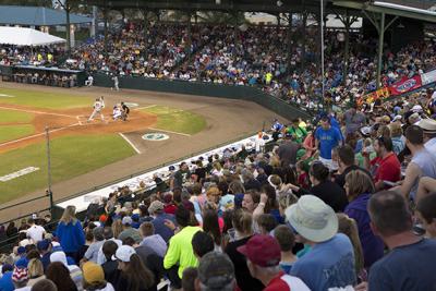 Fans watch the Daytona Tortugas play a family-friendly game of baseball at Jackie Robinson Stadium in Daytona Beach, Florida.