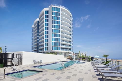 Hotel pool and hot tub with Max Beach Resort in the background