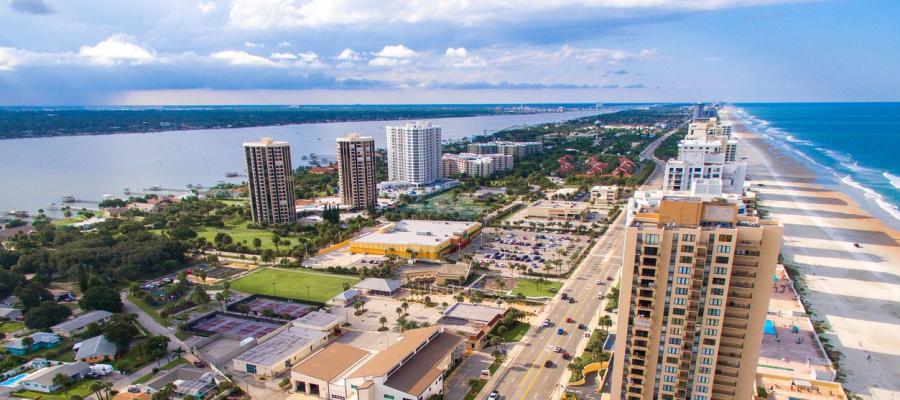 Aerial of hotels with river and ocean views