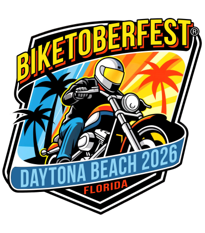 Biketoberfest event logo/badge featuring an illustrated motorcyclist leaning into a turn, with palm trees and a sunset in the background, and a ribbon reading "Daytona Beach 2026 Florida."