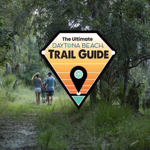 Daytona Beach Ultimate Trail Guide Image with a family hiking in the woods.