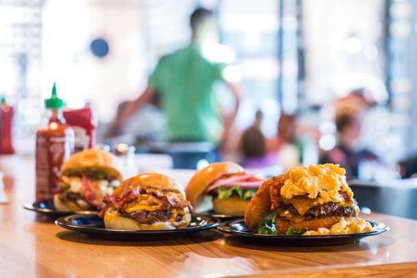 Four plated burgers from Zombie Burger + Drink Lab