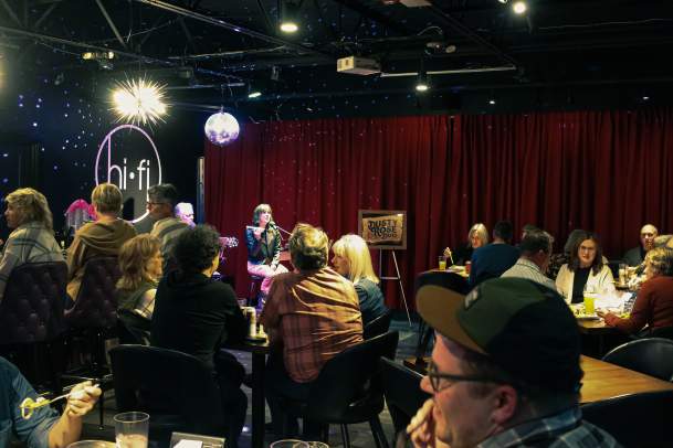 A group of people enjoying live music at HiFi Brew Lounge
