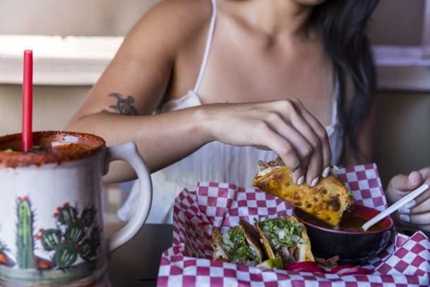Woman Eating Tacos in Des Moines