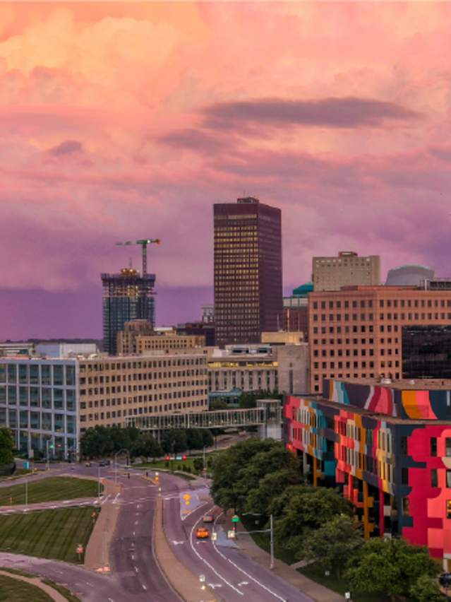 Des Moines skyline over a colorful sunset