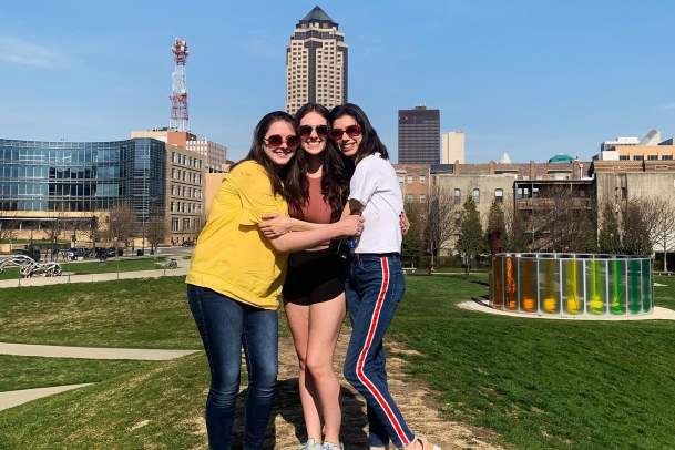 Three friends posing in the Sculpture Park