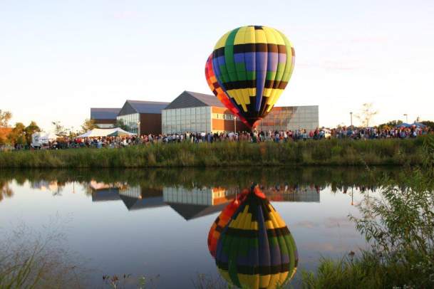 People standing around hot air balloon outside West Des Moines City Hall