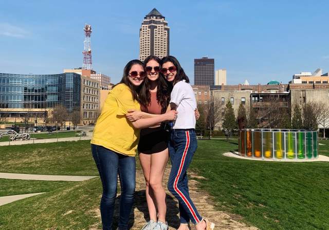 Three friends posing in the Sculpture Park