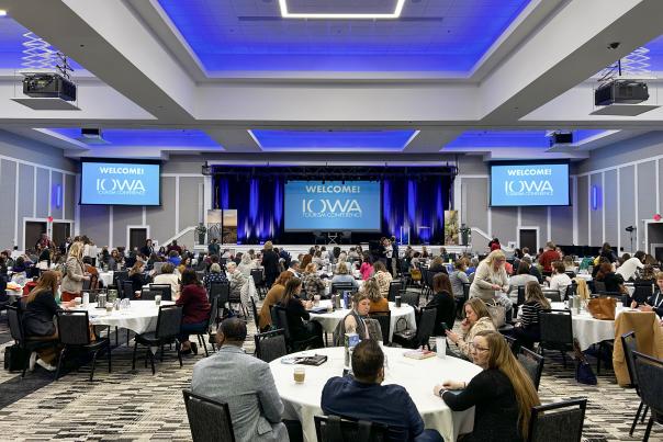 Large room of people during the opening session of the Iowa Tourism Conference
