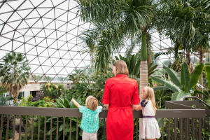 A woman and her two kids admiring the Greater Des Moines Botanical Garden