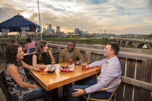 A group of friends dine on a patio at restaurant in downtown Des Moines, Iowa.
