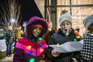 Two kids caroling