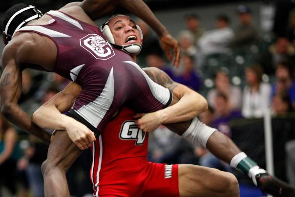 Friday, March 2, 2012-  NAIA National Wrestling Tournament at Des Moines. Session 4. Photo by Doug Wells/William Photography. Omi Acosta of Grand View University lifts Tim Thurston of Campbellsville on his way to victory at 133 Lbs in a semi-final match.