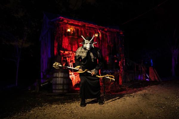 A live actor portraying a spooky character at Sonny Acres Farm brings Halloween excitement to life with an engaging costume and theatrical presence.