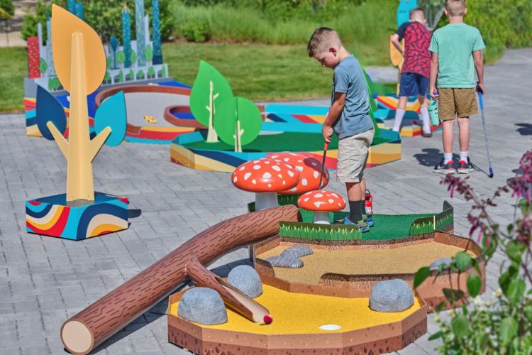 children playing mini golf