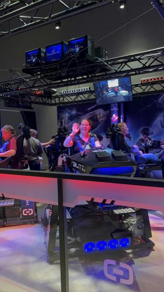 A person sitting in a virtual reality experience