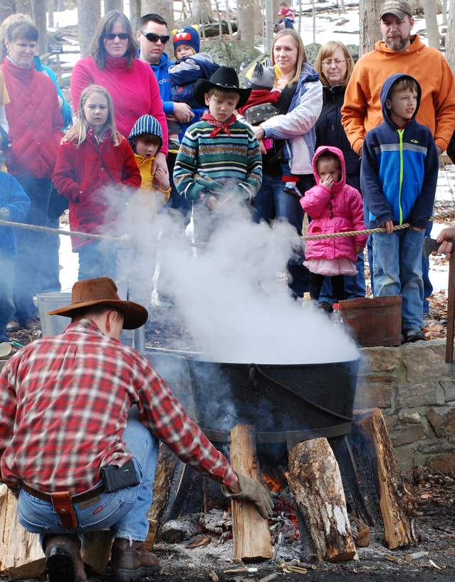 People Watching A Maple Syrup Demonstration In Frederick County, MD