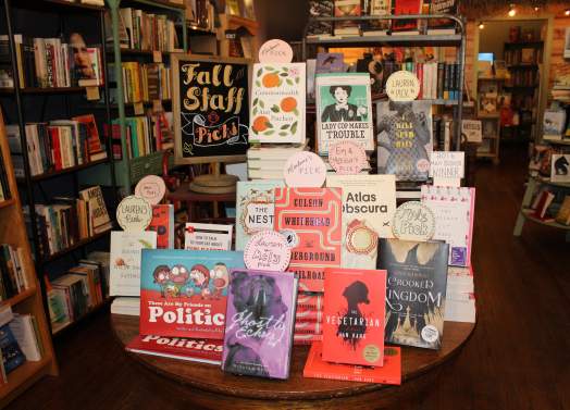 Staff Picks books table at the Curious Iguana Downtown Frederick