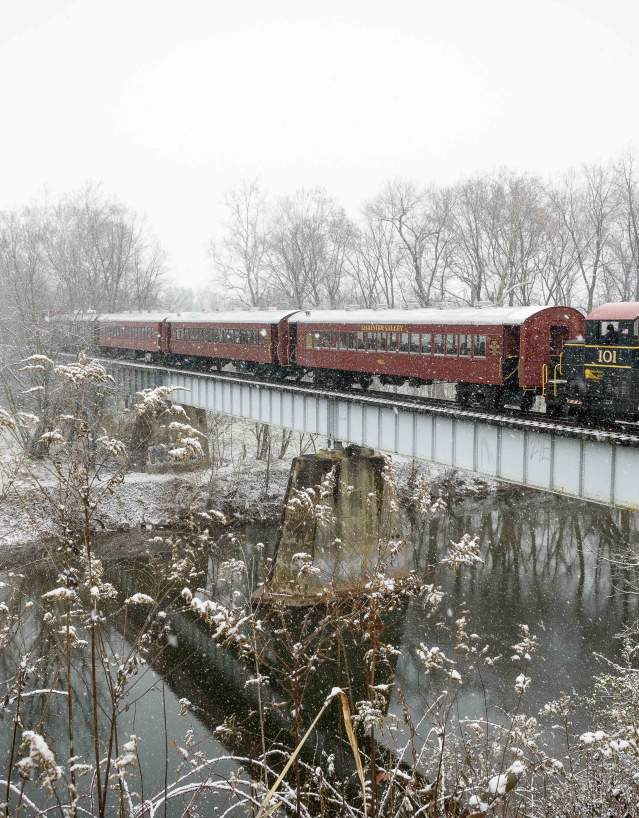 Walkersville Southern Railroad Santa Train going over a bridge during the snow