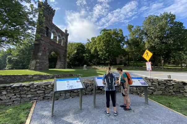 Two women looking at the National War Correspondents Memorial Arch