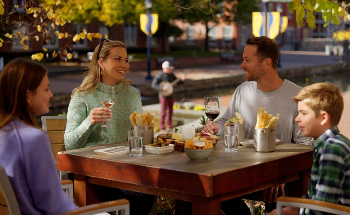 Family eating outdoors at the Wine Kitchen