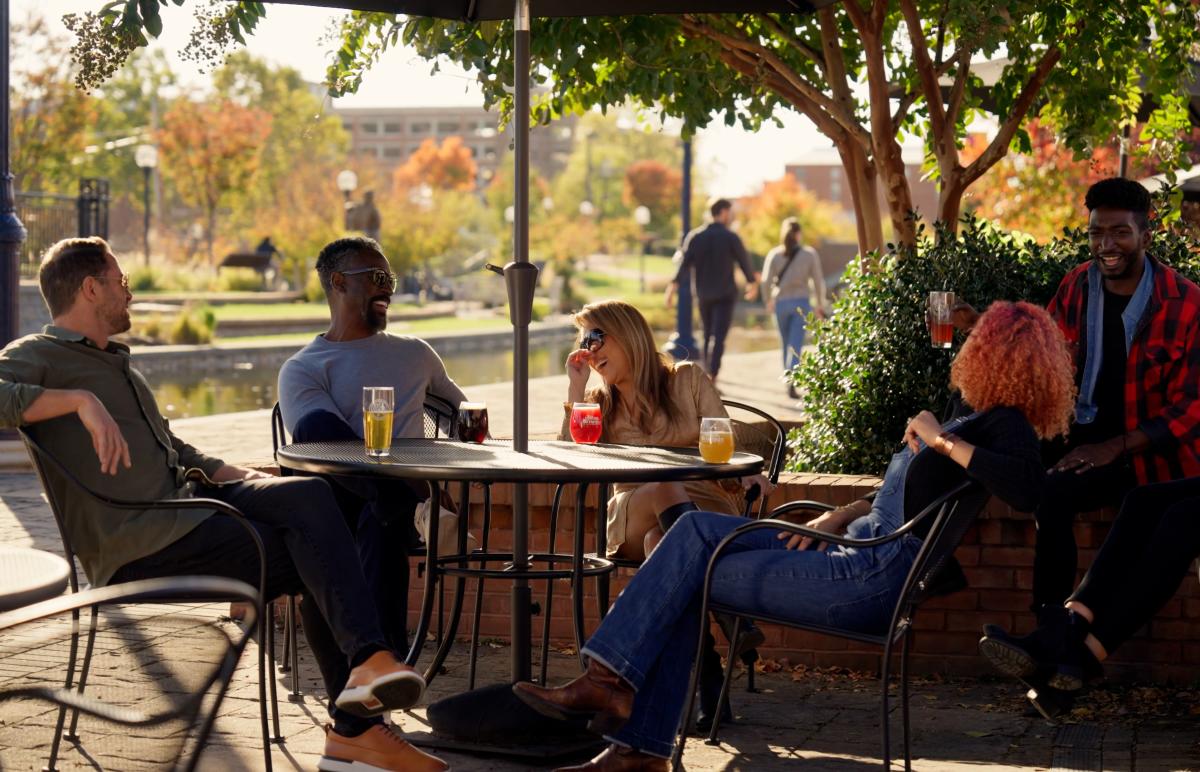 Group sitting at Idiom Brewery patio